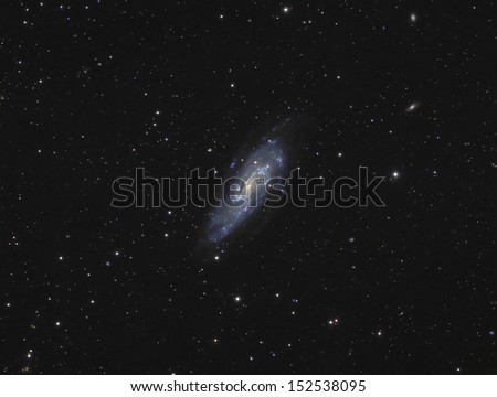 Spiral Galaxy NGC4559: A spiral galaxy about 29 million light years away in the constellation Coma Berenices.