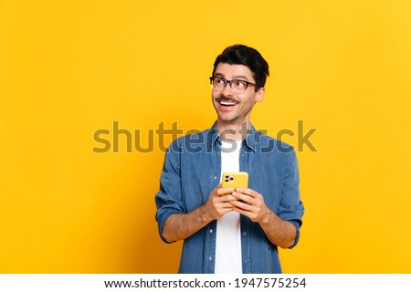 Similar – Image, Stock Photo Trendy man using smartphone in city