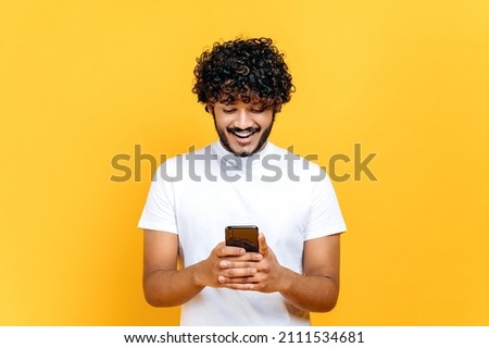 Similar – Image, Stock Photo Man using his smartphone sitting on a ledge outside