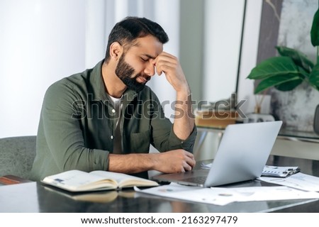 Similar – Image, Stock Photo Man entrepreneur having business  conversation on mobile phone. Businessman holding documents and smartphone working with data on charts and graphs in office