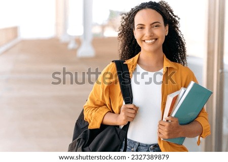 Similar – Image, Stock Photo Lovely curly woman with combed hair, keeps hand in pocket