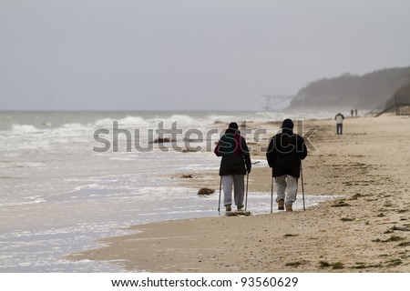 Nordic walking couple - autumn baltic sea, Poland