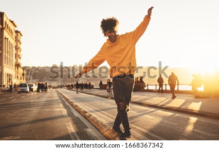 Similar – Image, Stock Photo Playful trendy young ethnic woman in deserted countryside