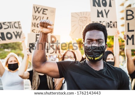 Black lives matter activist movement protesting against racism and fighting for equality - Demonstrators from different cultures and race protest on street for justice and equal rights 