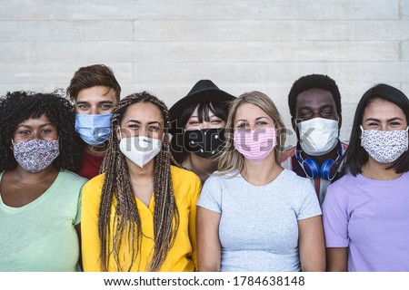 Group young people wearing face mask for preventing corona virus outbreak - Millennial friends with different race and culture portrait -  Coronavirus disease and youth multi ethnic concept 