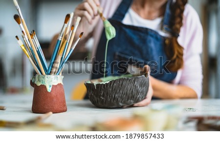 Similar – Image, Stock Photo Craftswoman painting a bowl made of clay in art studio