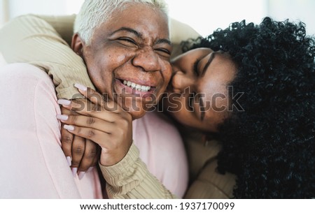 Happy Hispanic mother and daughter having tender moment together - Parents love and unity concept Stock foto © 