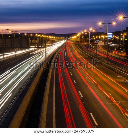 BUDAORS, HUNGARY - JAN 12: Red tail lights and traffic lights in a long exposure photograph over a motorway near Budapest on January 12, 2015 in Budaors Hungary