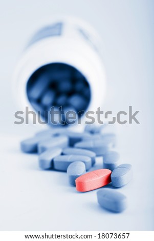 blue prescription pills with one red pill