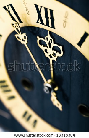 antique looking clock dial showing time about twelve