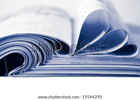 stack of magazines toned blue isolated
