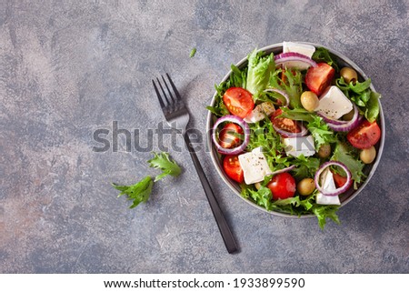 tomato salad with brie cheese olives onion lettuce