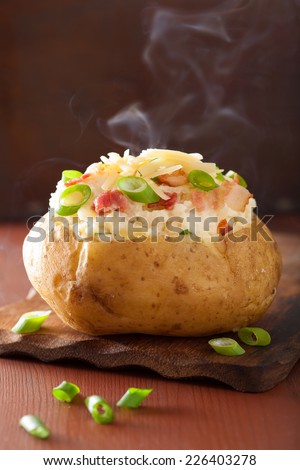 baked potato in jacket with bacon and cheese