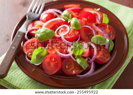 healthy tomato salad with onion basil olive oil and balsamic vinegar