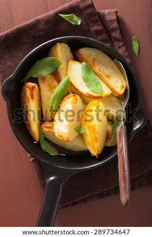 baked potato wedges in black frying pan