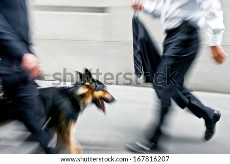 walking the dog on the street in motion blur