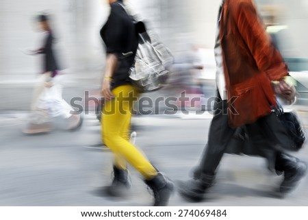 abstract image of business people in the street  modern style and with a blurred background