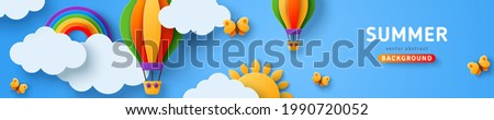 Beautiful fluffy clouds on blue sky background with summer sun, butterfly, hot air balloons and rainbow. Vector illustration. Paper cut style web header. Place for text