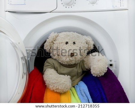 Washing machine, children\'s toy and colorful laundry to wash