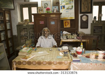 VARANASI, INDIA, Jan 9, 2015: Unidentified indian old Man in his Book Shop (library) on Jan 9, 2015, Varanasi, India. According to legend, Varanasi was founded by Lord Shiva