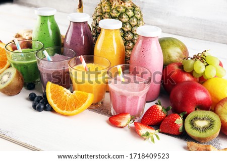 Assortment of fruit smoothies in glass bottles. Fresh organic Smoothie ingredients. Smoothies for health or detox diet food concept. Foto d'archivio © 