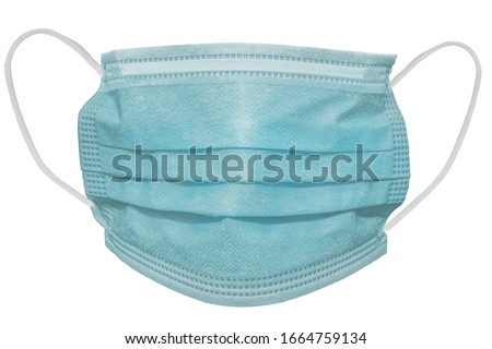 Surgical or medical mask with rubber ear straps. Typical 3-ply doctor mask to cover the mouth and nose. Procedure mask from bacteria. Protection concept.