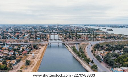 Similar – Image, Stock Photo Old bridge across channel in sunset