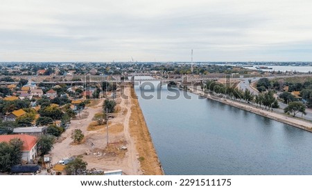 Similar – Image, Stock Photo Old bridge across channel in sunset