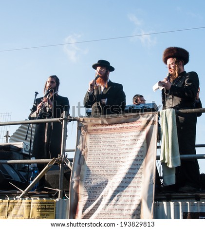 MERON, ISRAEL - MAY 18, 2014: Orthodox Jews play music and sing to the dancing crowd at the annual hillulah of Rabbi Shimon Bar Yochai, in Meron, on Lag BaOmer Holiday