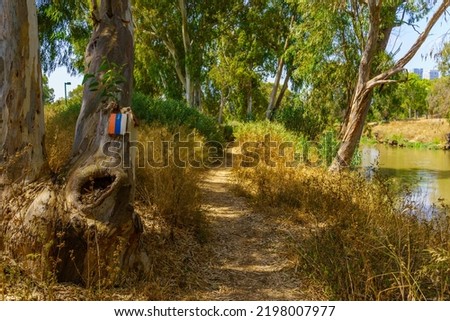 Similar – Image, Stock Photo Trail marker on a tree