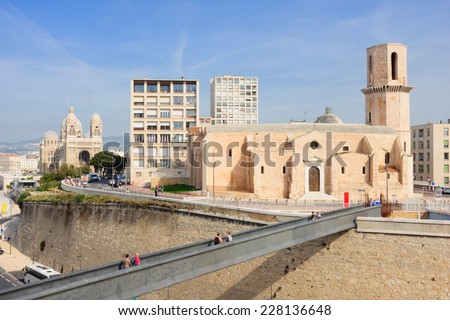 MARSEILLES, FRANCE - OCTOBER 20, 2014: The foot bridge from Fort St-Jean, St-Lauernt church and the Cathedrale de la Major (main cathedral), in Marseilles, France