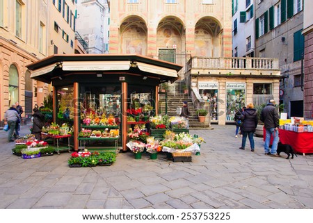 GENOA, ITALY - JAN 24, 2015: Scene of Piazza Banchi and San Pietro church, with shops, local and tourists, in Genoa, Liguria, Italy