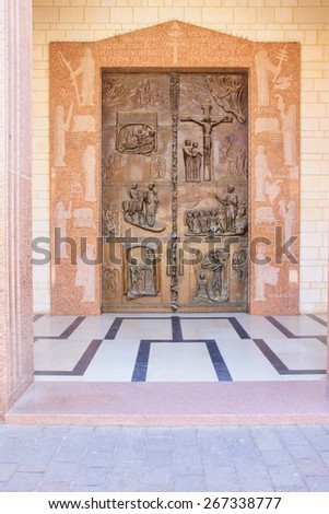 NAZARETH, ISRAEL - APR 05, 2015: A decorated wooden door in the main entrance of the Church of Annunciation, in Nazareth, Israel