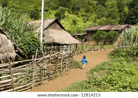 Hmong hill tribe village in northern Laos. Typical poor village and thatched huts
