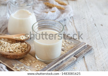 Vegan oat milk, non dairy alternative milk in a glass close up 商業照片 © 