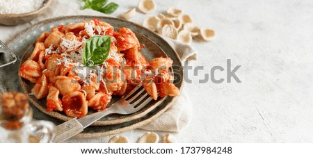 Similar – Image, Stock Photo South italian  pasta orecchiette with tomato sauce and cacioricotta cheese