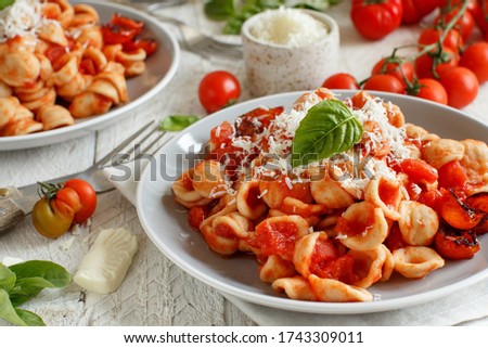 Image, Stock Photo South italian  pasta orecchiette with tomato sauce and cacioricotta cheese