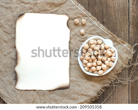Raw Organic chickpea in a bowl on wooden table