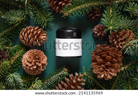 Similar – Image, Stock Photo Brown glass jar near fir branches and pine cones on dark green top view. Brand packaging mockup.