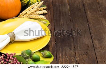 Bright autumn table setting on wooden table