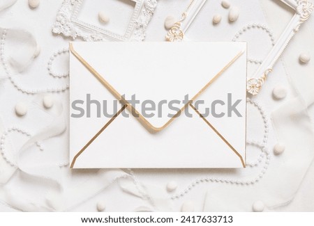 Similar – Image, Stock Photo Blank envelope near pastel pom-poms on light blue top view