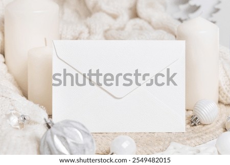 Similar – Image, Stock Photo Blank envelope near pastel pom-poms on light blue top view