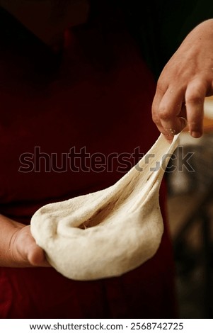 Similar – Image, Stock Photo Cook kneading dough with hand on table