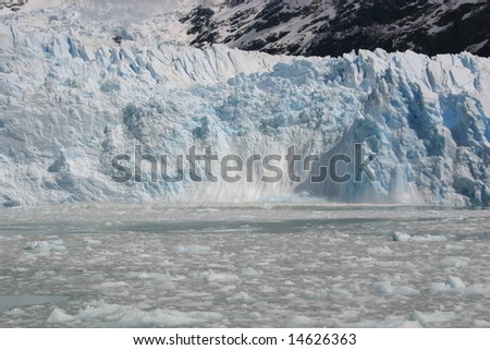 Ice breaking off glacier in Los Glaciares National Park, Calafate, Patagonia, Argentina
