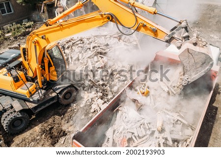 Similar – Image, Stock Photo Bucket with building rubble in front of a facade