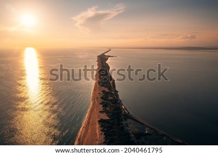 Similar – Foto Bild Sandstrand zwischen langen Klippen am Meer