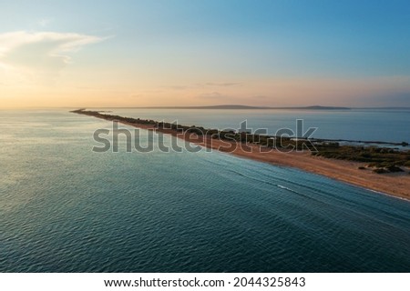 Similar – Foto Bild Sandstrand zwischen langen Klippen am Meer