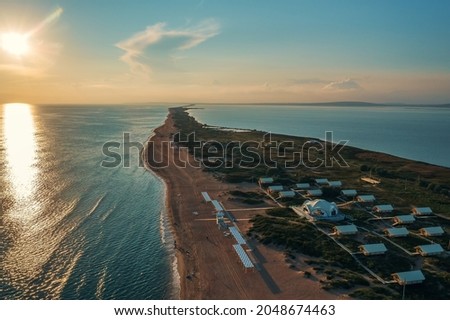 Similar – Foto Bild Sandstrand zwischen langen Klippen am Meer