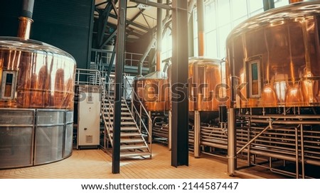 Brewery equipment. Brew manufacturing. Round cooper storage tanks for beer fermentation and maturation Stock foto © 