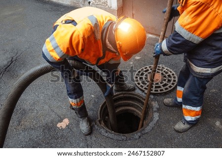 Similar – Foto Bild Wasserschlauch auf einer Baustelle entleeren.